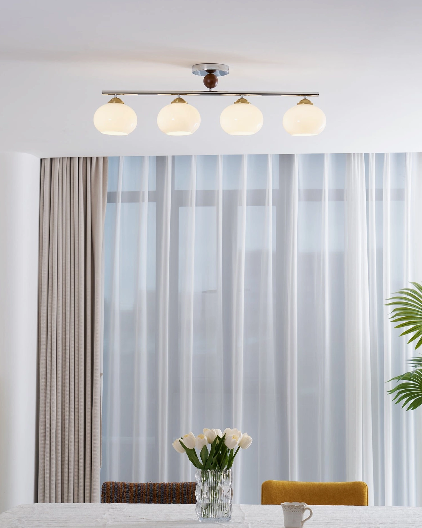 Orley linear semi-flush glass ceiling fixture providing even ambient light across room