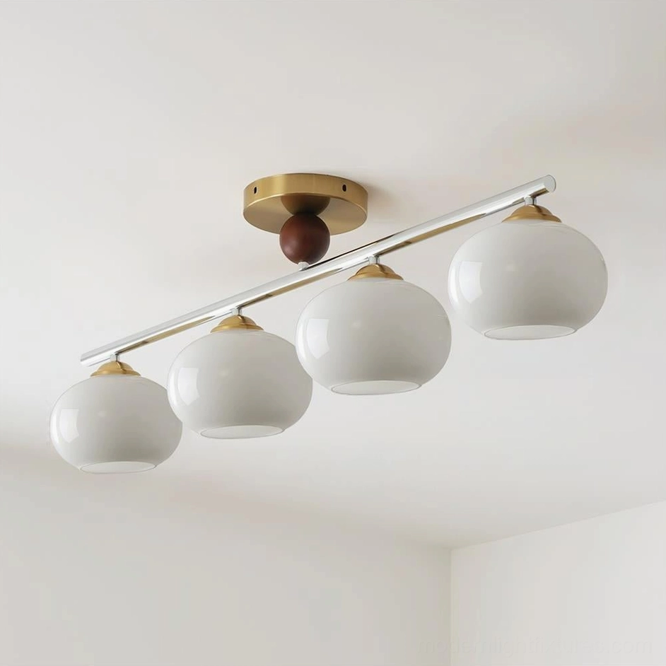 Orley 4-light linear glass ceiling fixture with gold canopy and white rounded glass shades