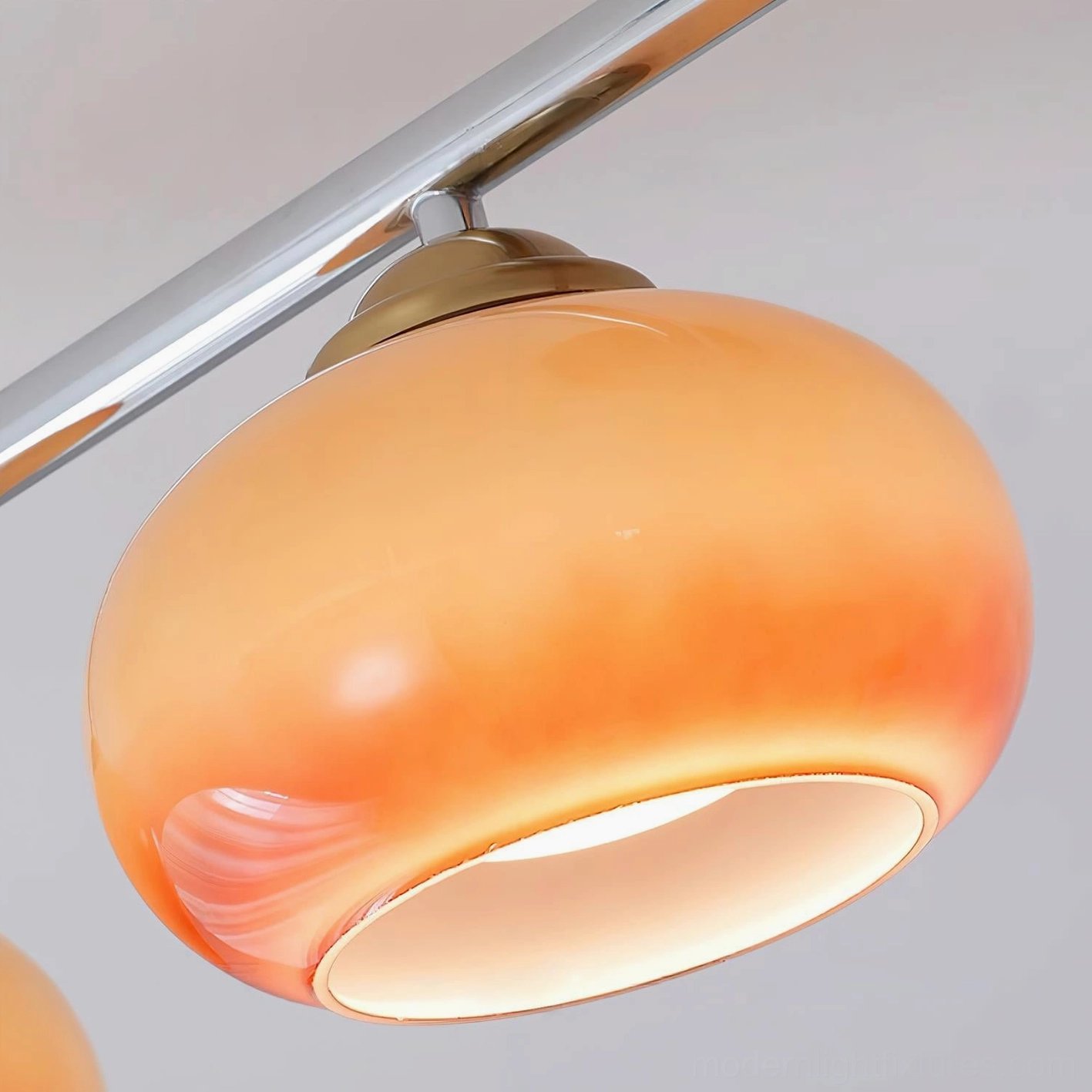 Orley 4-globe ceiling fixture installation detail showing metal canopy and glass shade attachment