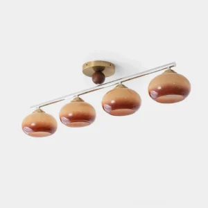 Orley 4-light linear glass ceiling fixture with brass canopy and gradient brown glass shades, front studio view