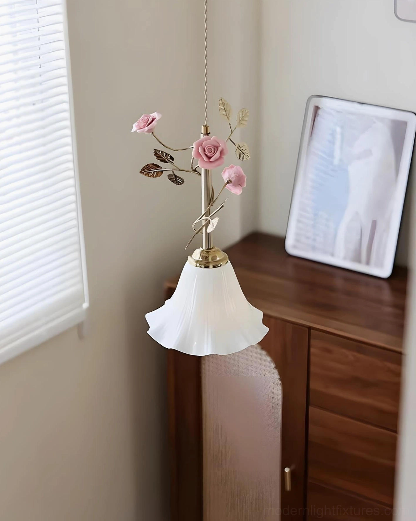 Ornamental floral pendant lamp showing sculptural leaf details and romantic rose decorations