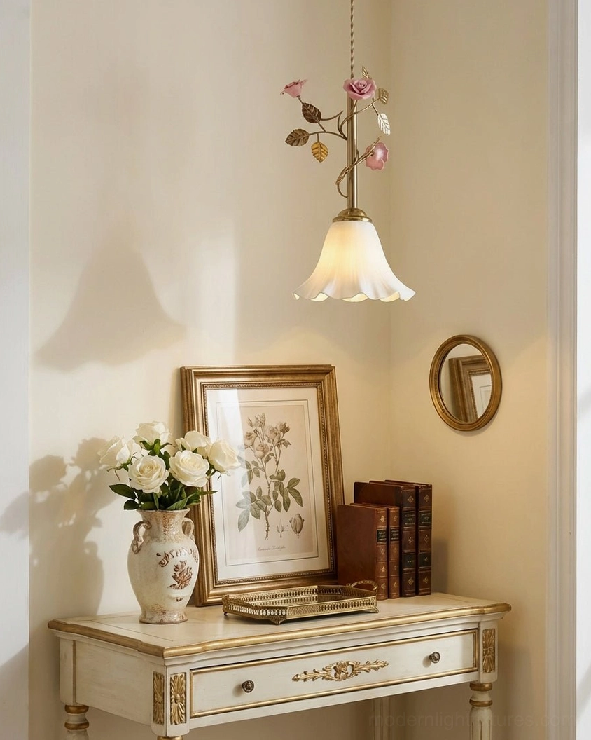 Brass botanical pendant light in feminine vanity nook with antique décor and wall art