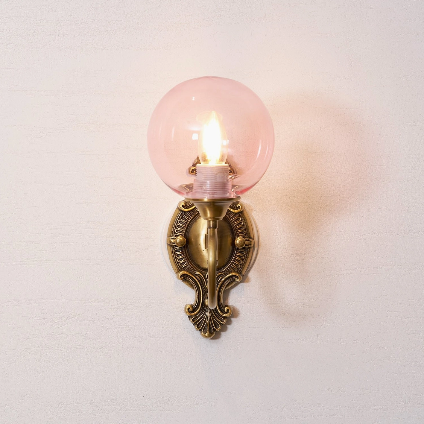 Multiple ornate brass wall sconces comparison, single-head and dual-head vintage fixtures