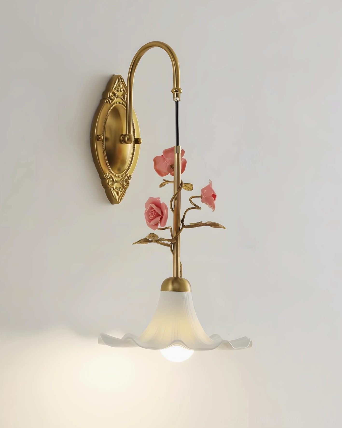 Ornella carved brass wall lamp with pink rose botanical accents and warm ambient light