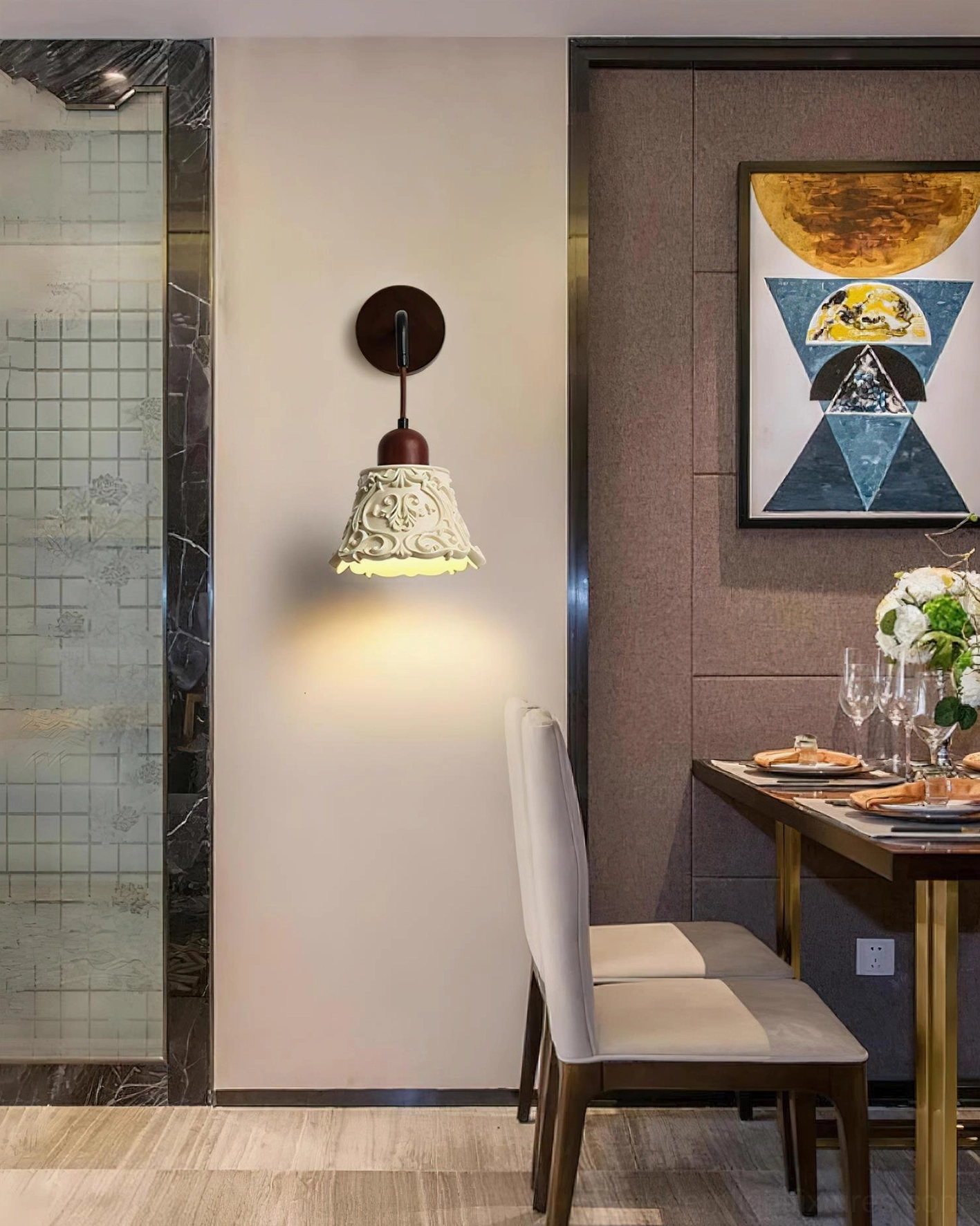 Ornella wall sconce close-up showing walnut wood mounting bracket and carved ivory resin shade artistic details