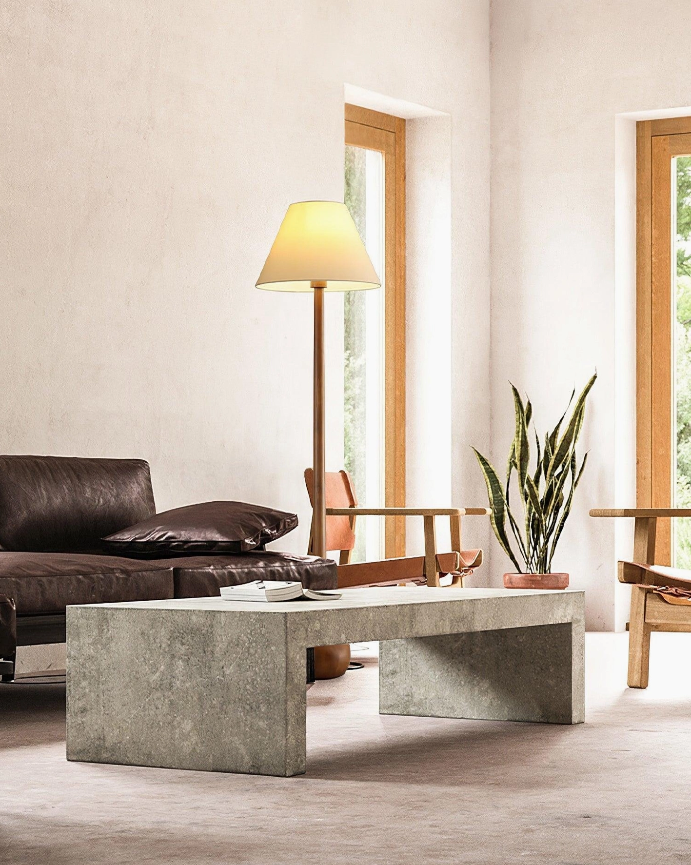 Osaka minimalist floor lamp in modern living room with leather sofa and natural window lighting