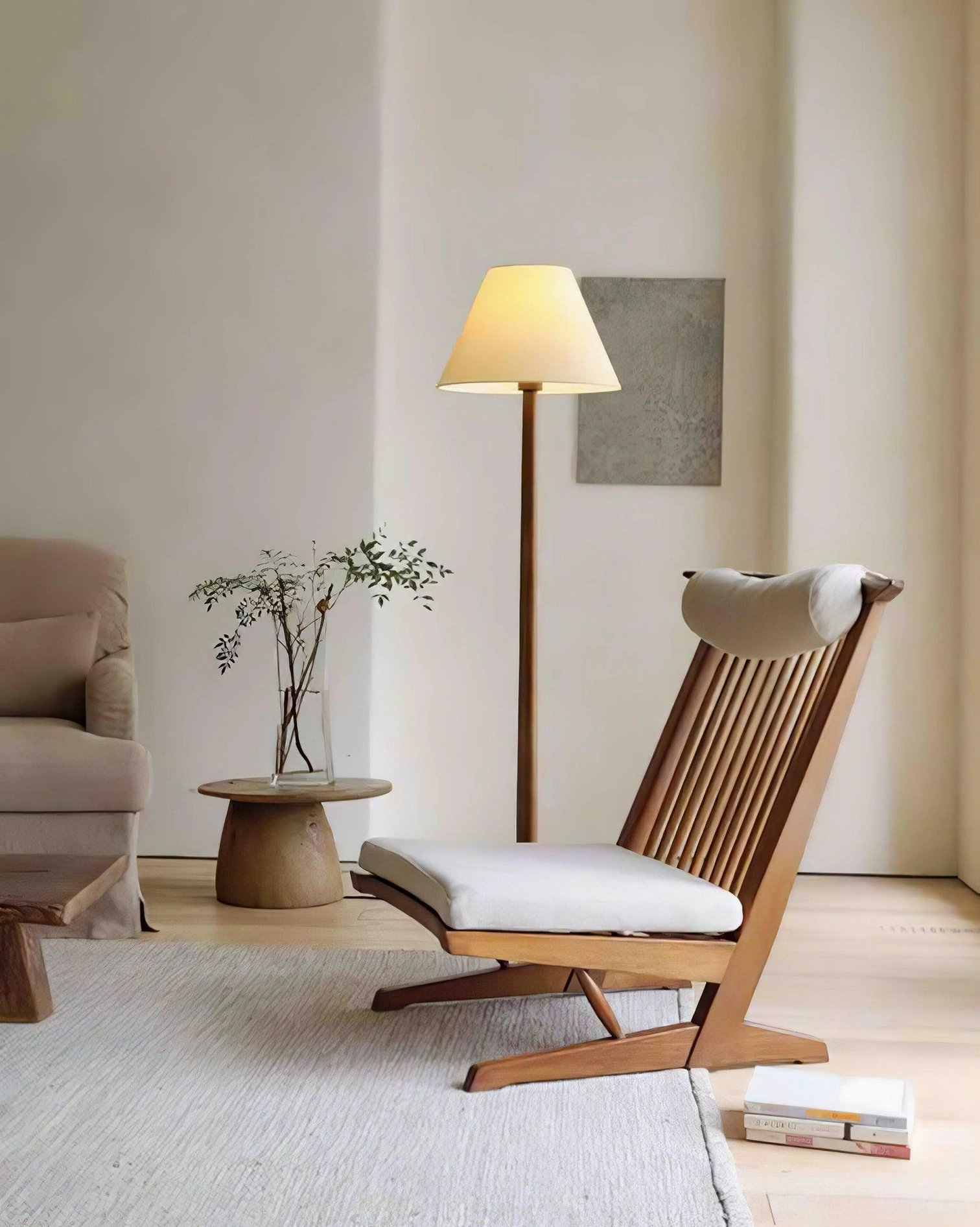 Osaka floor lamp in relaxing lounge area with reading chair and warm off-white fabric shade - japandi style
