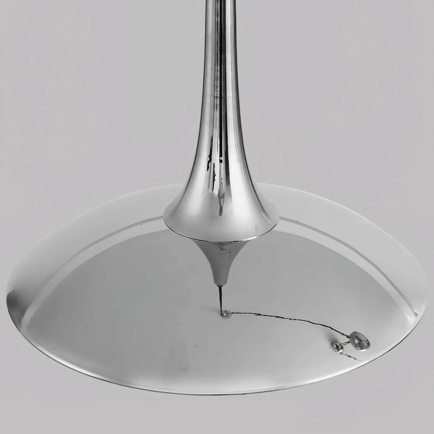 Oscar pendant light bottom-up detail view showing polished metal disc shade and exposed lamp socket