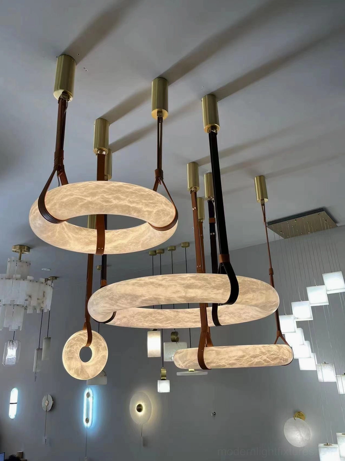 Oslo pendant light fixture detail showing precision brass hardware and alabaster attachment mechanism