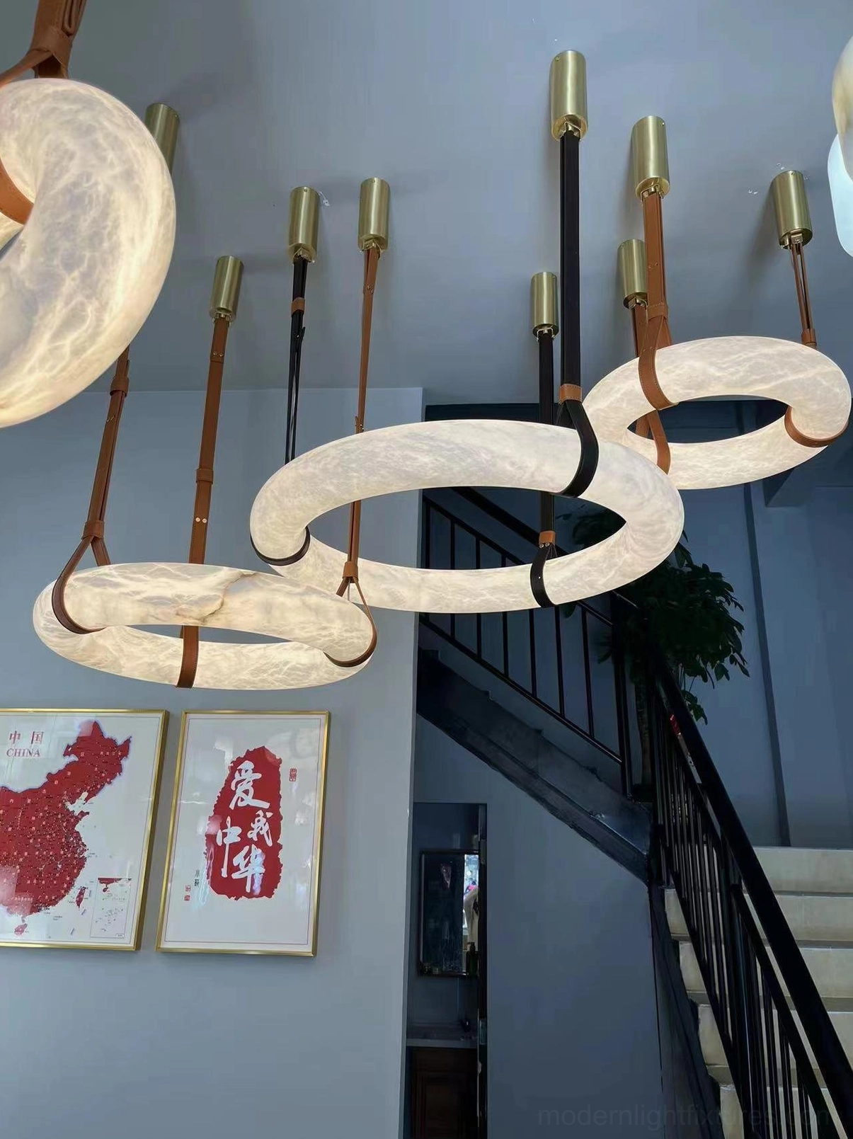 Multiple size variants of Oslo alabaster pendant lights displayed showing range from compact to statement-size fixtures