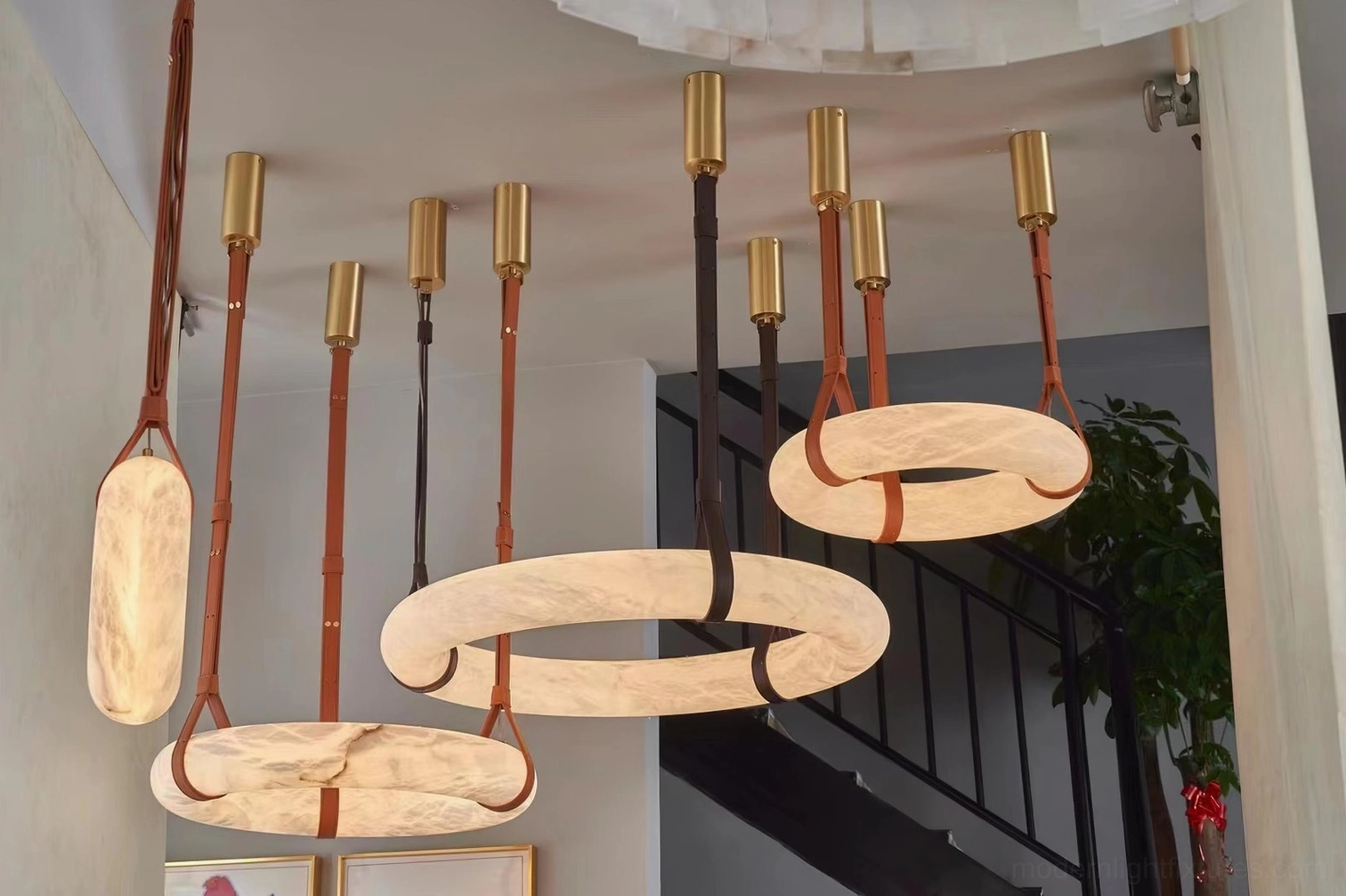 Detail of Oslo pendant light sloped ceiling adapter installation showing fixture compatibility with angled ceiling mounts
