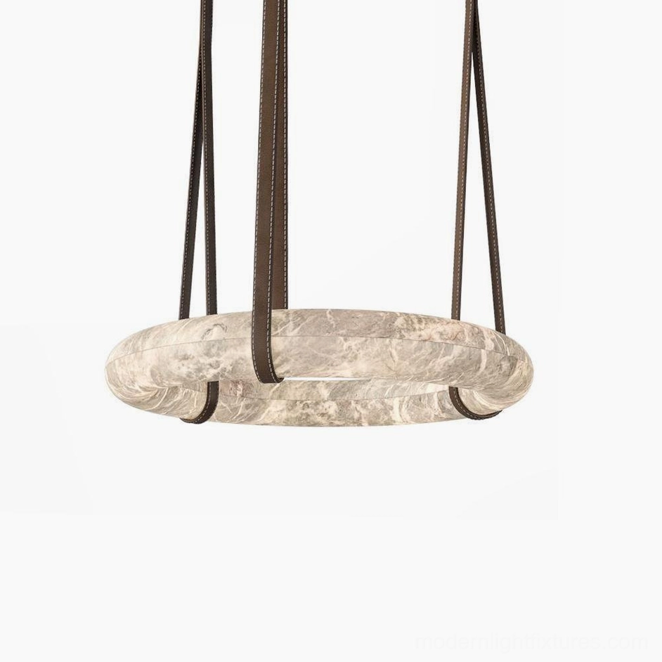 Clustered Oslo alabaster pendant lights suspended at varying heights for dramatic dining room lighting effect