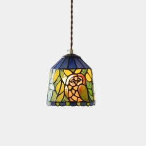 Owl stained glass pendant light with handcrafted glass shade and brass fixture on white background