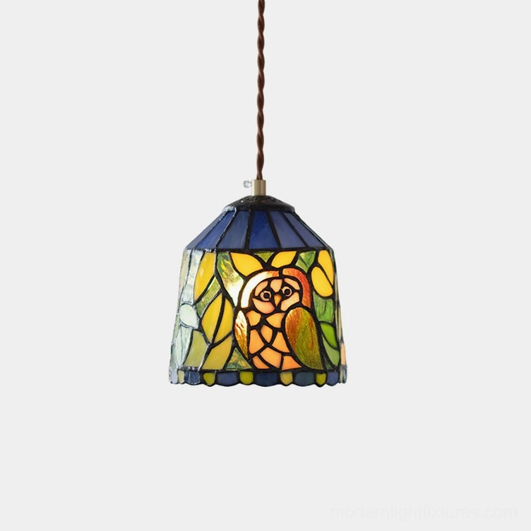 Owl stained glass pendant light with handcrafted glass shade and brass fixture on white background