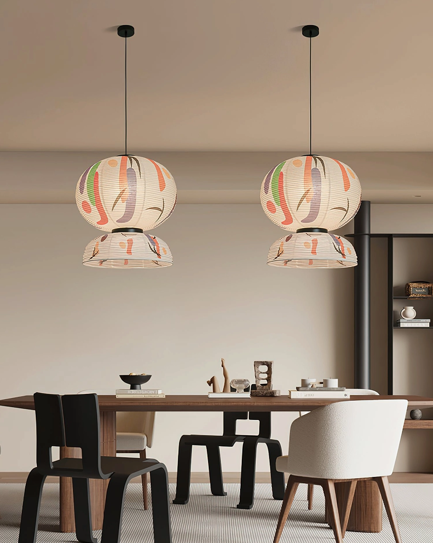 Pair of matching Formakami paper pendant lamps hanging in warm neutral modern residential dining area with matching fixtures