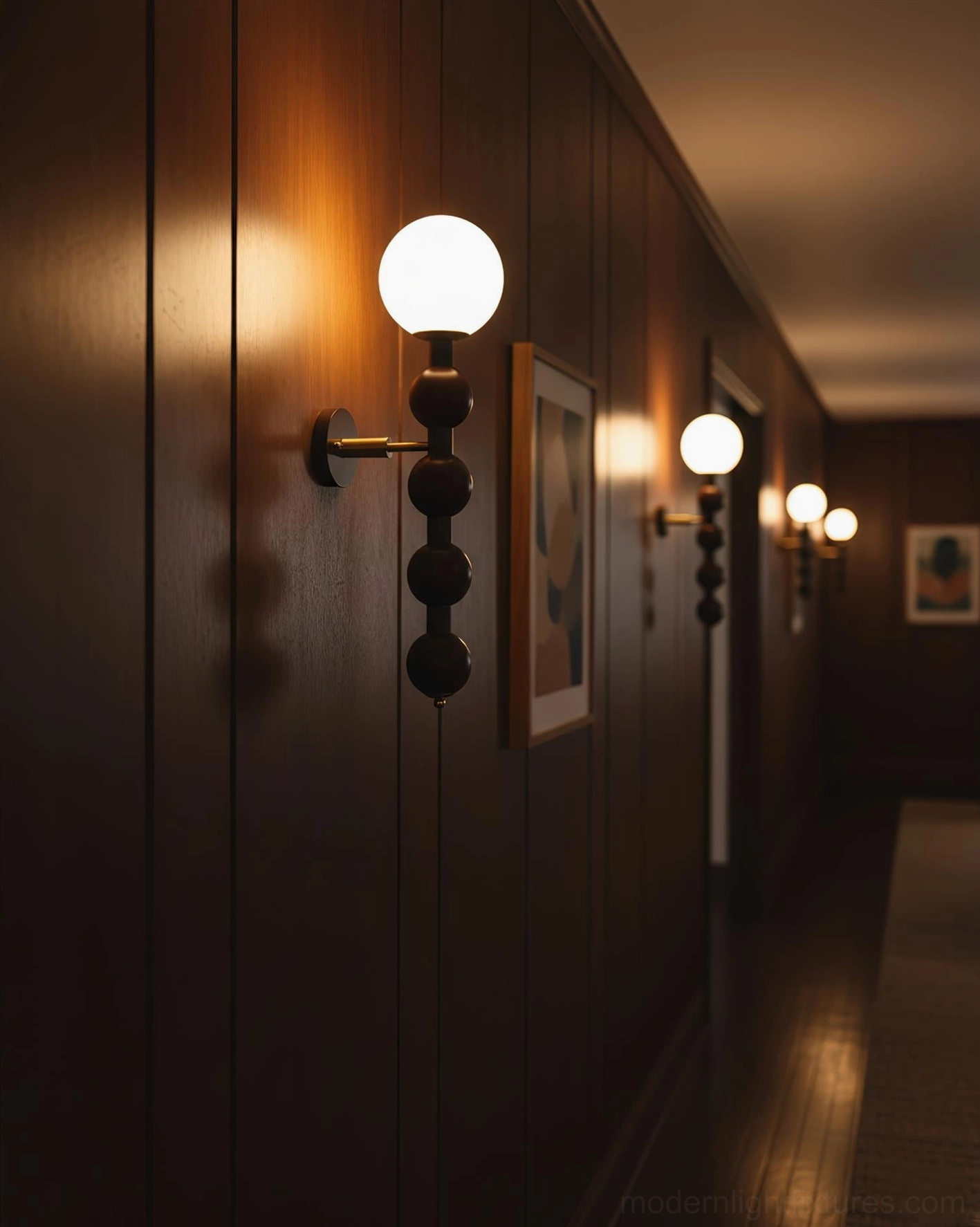 Pair of beaded globe wall sconces symmetrically mounted in dark wood hallway corridor