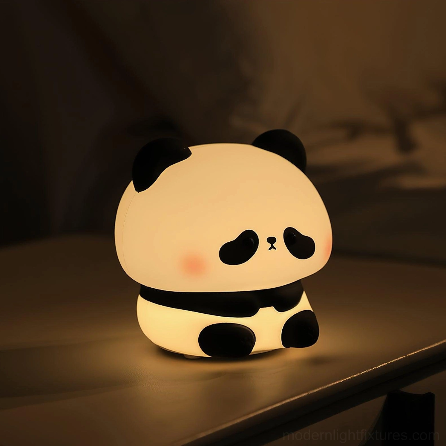 Panda night light on wooden table with warm soft illumination - cute cheek details