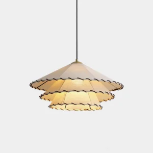 Panya three-tier ruffled fabric pendant light with off-white shade and dark ruffled trim, hanging from chain against white studio background