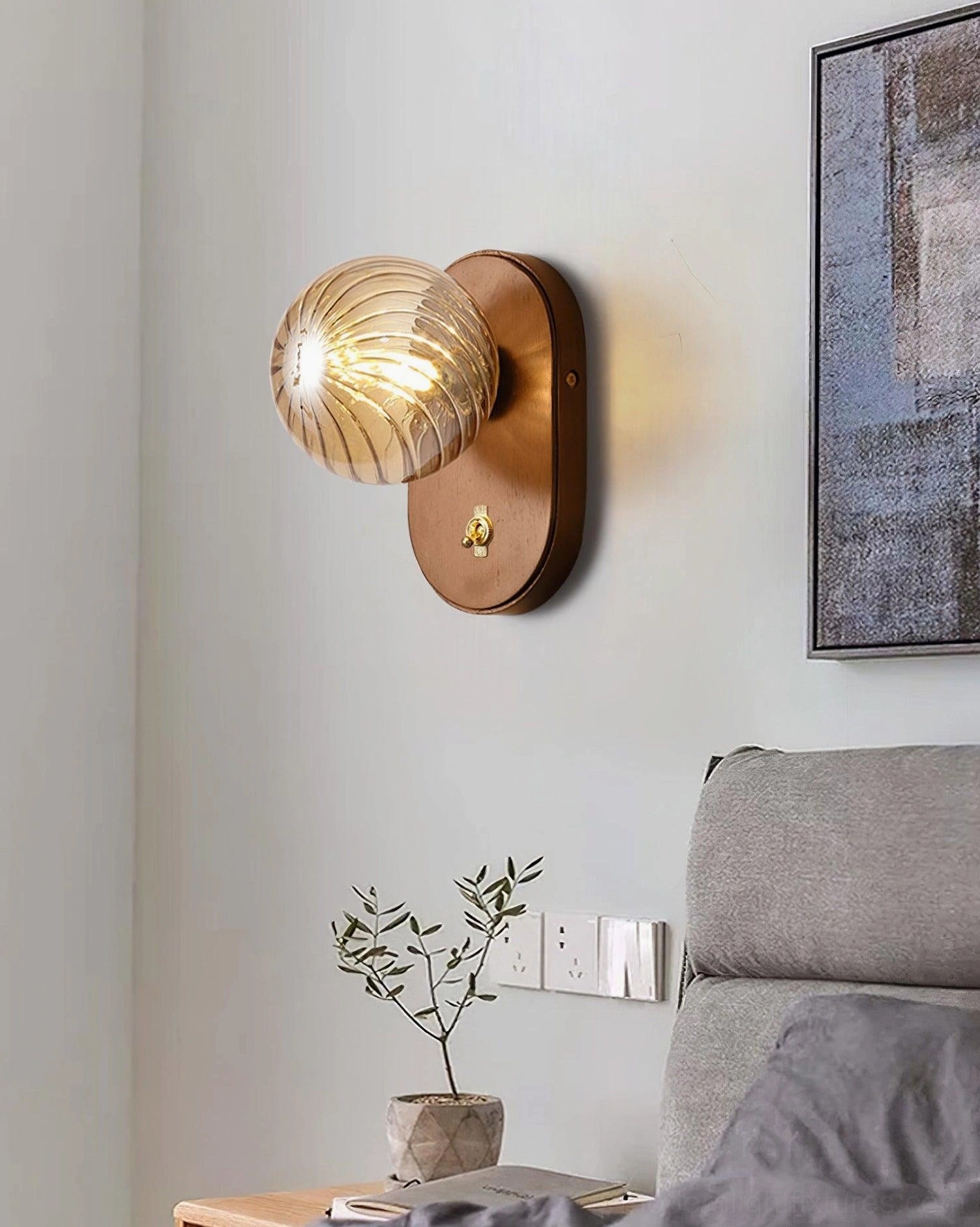 Side angle view of Paola ribbed glass orb wall lamp showing architectural form