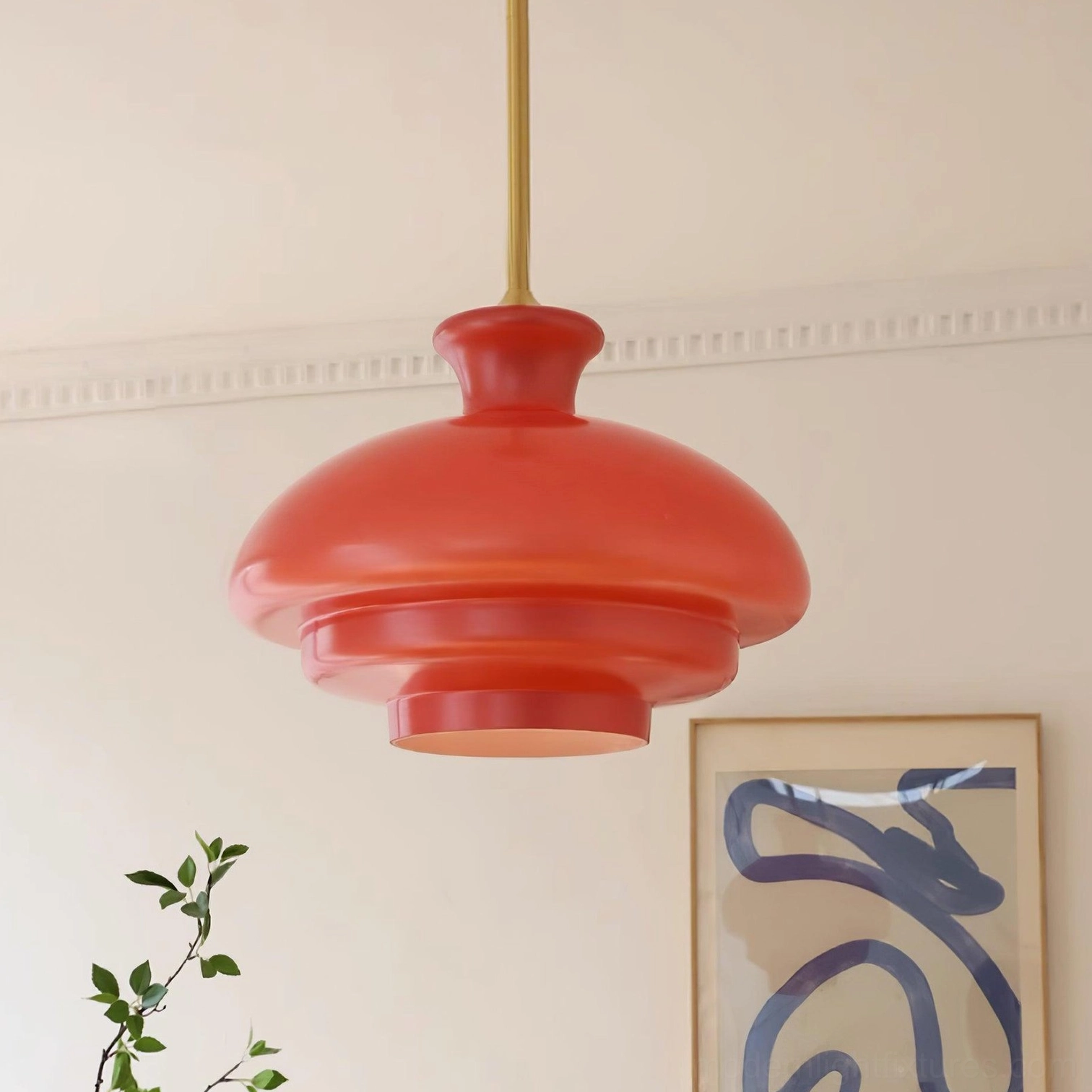 Paolina burgundy red tiered glass pendant light in modern home interior with crown moulding and artistic wall decor, three-quarter perspective