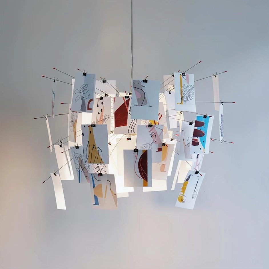Decorative paper chandelier hanging in gallery-style dining space with neutral-toned paper panels