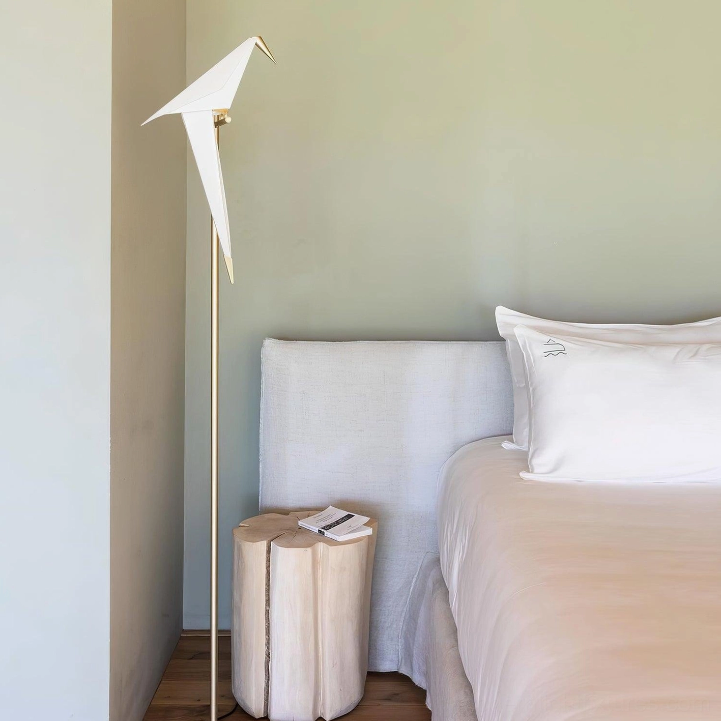Paper crane floor lamp in contemporary interior setting, artistic lighting solution showcase