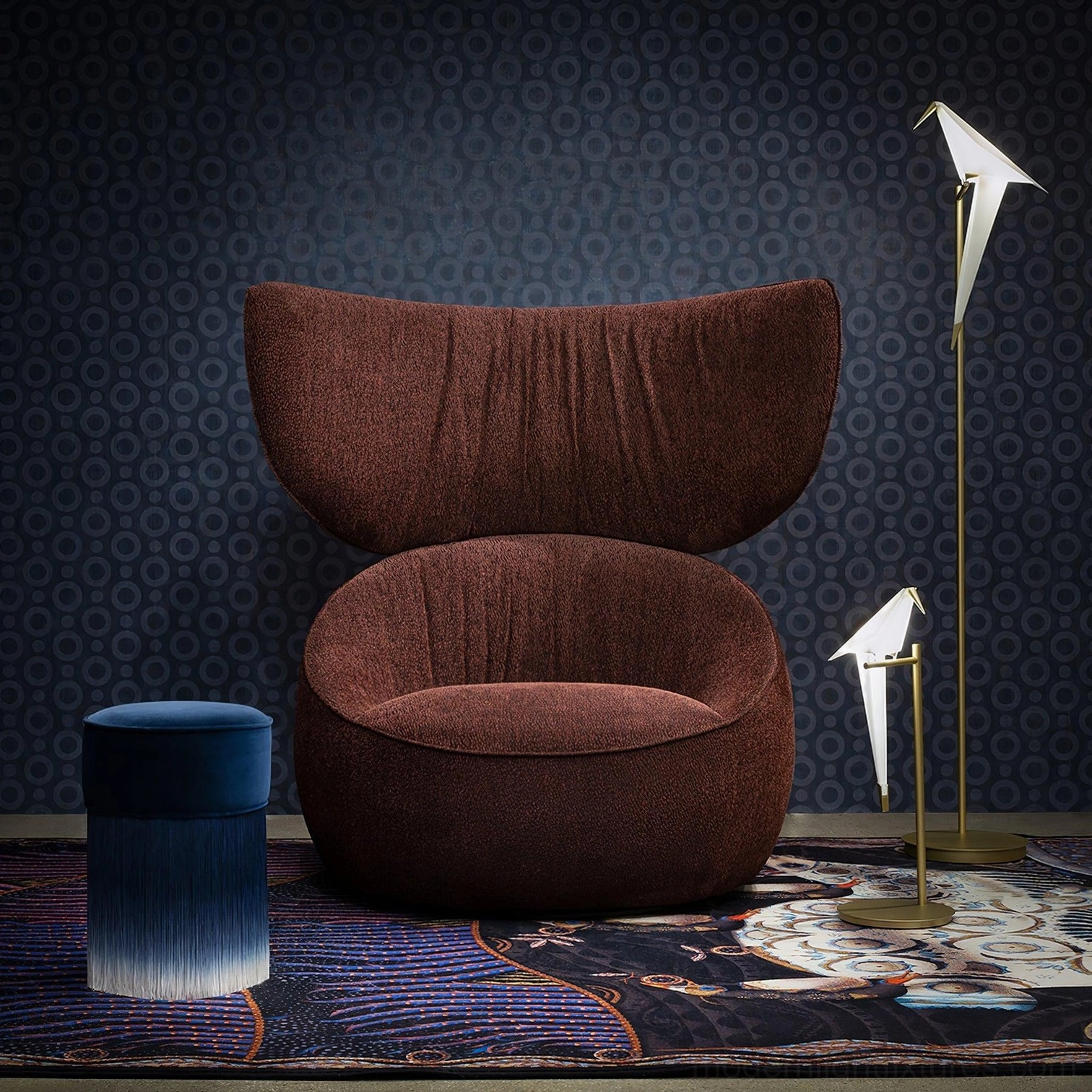 Paper crane floor and table lamps in luxury living room with velvet armchair and patterned wallpaper