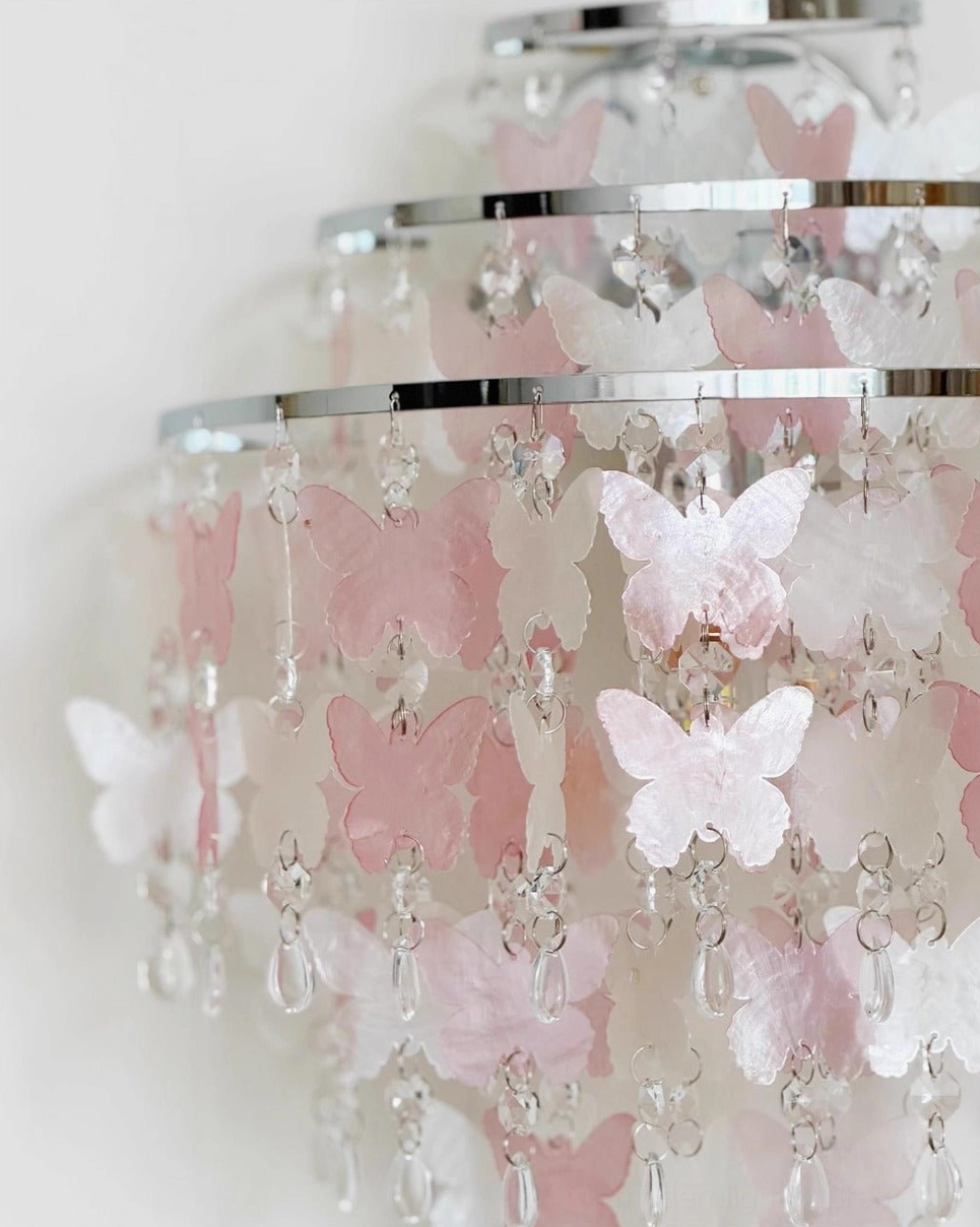 Papillia romantic butterfly wall light fixture showcasing delicate translucent butterfly elements and polished chrome construction
