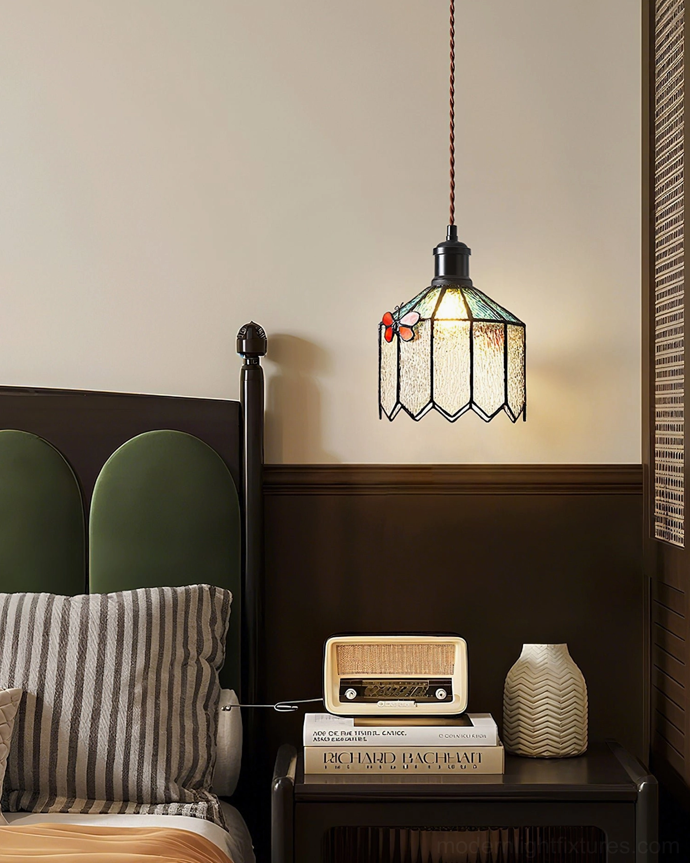 Papilune vintage pendant lamp hanging view illuminated in bedroom bedside setting creating warm ambient lighting