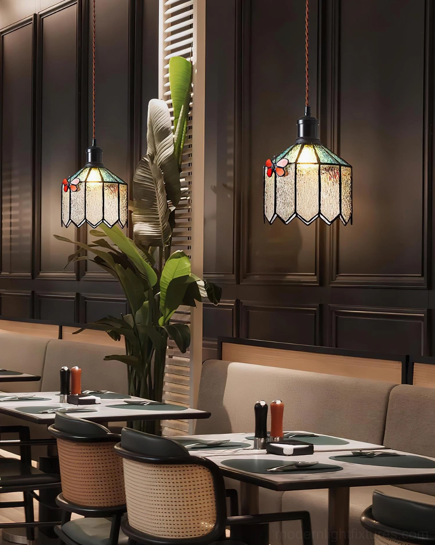 Papilune stained glass pendant lights paired in retro restaurant dining space with dark wood interior design