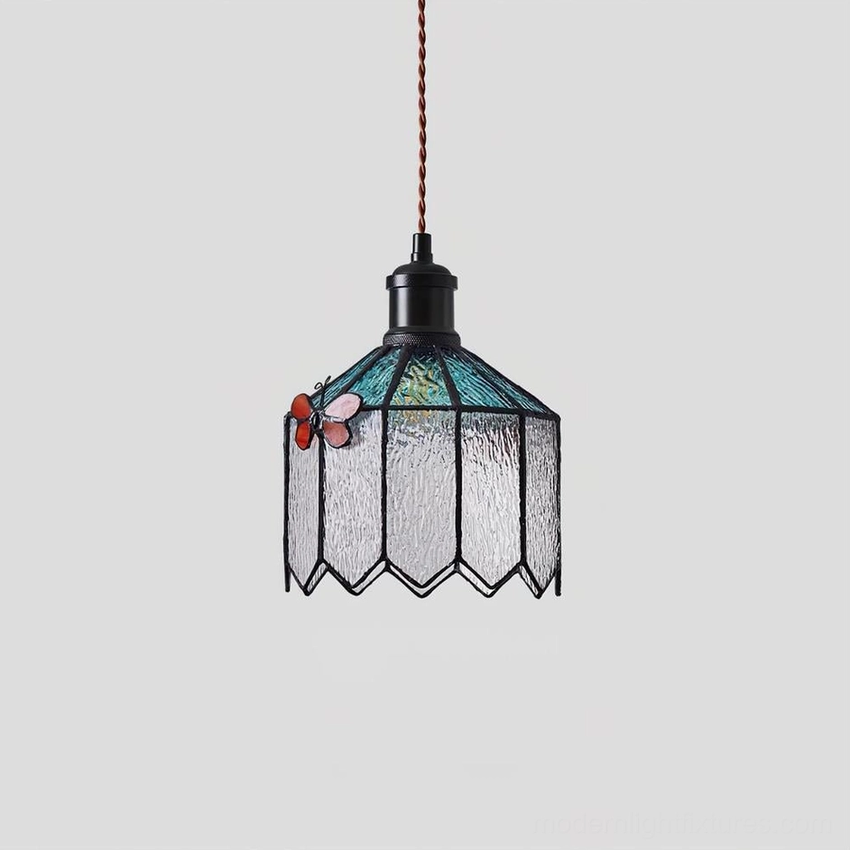 Papilune stained glass pendant lamp side view showing twisted brown vintage cord and butterfly decoration detail