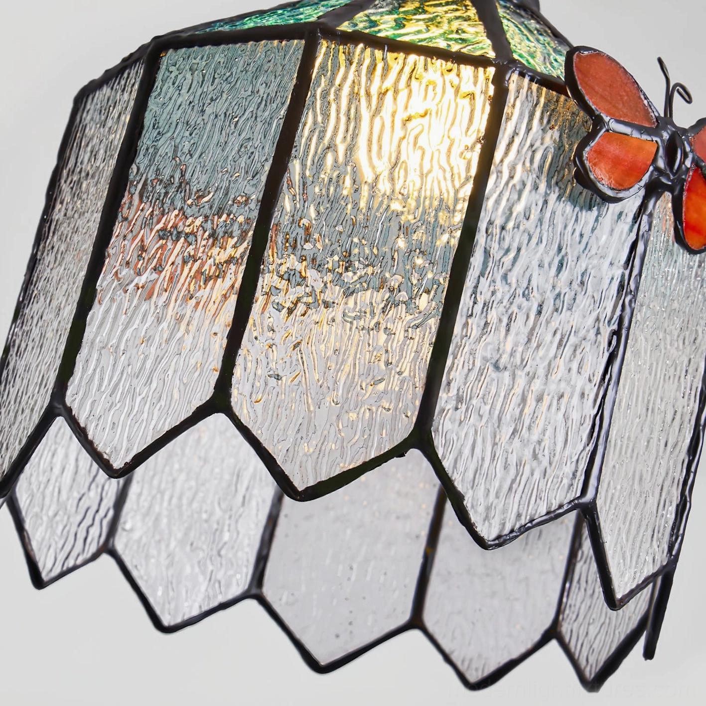 Papilune stained glass pendant light three-quarter angle view showing complete fixture design and artistic composition