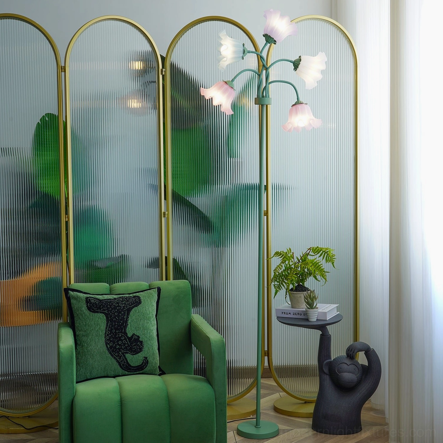 Artistic pastel floor lamp with round metal base positioned in cozy home lounge area for soft ambient illumination