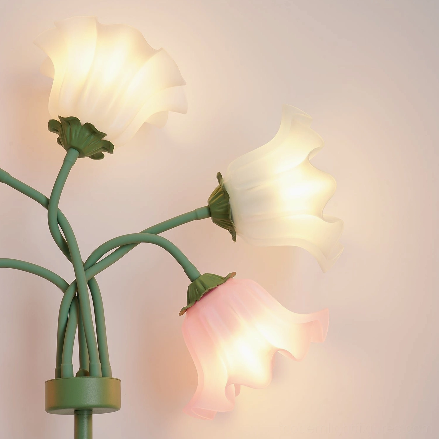 Close-up macro shot of illuminated dual-tone glowing pastel flower shades on lily of the valley floor lamp