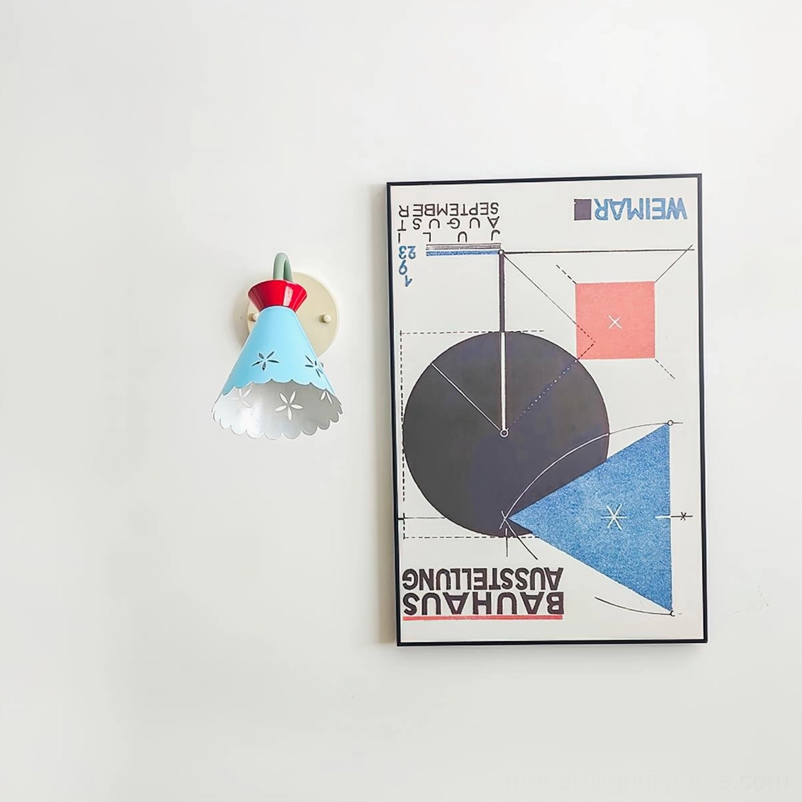 Vintage pastel wall lamp with green arm and red collar detail - design focus
