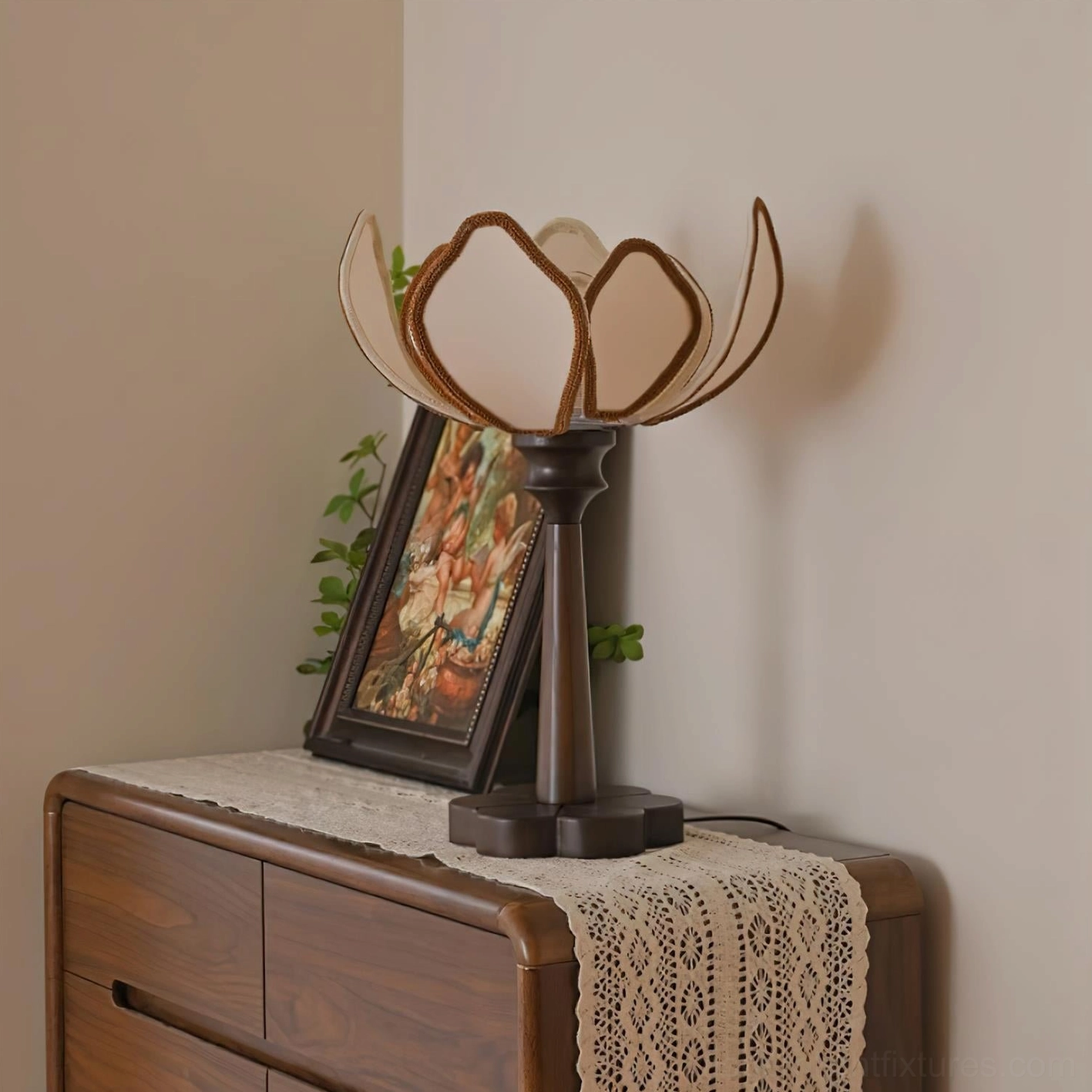 Pauline lotus petal table lamp glowing on vintage dresser with side three-quarter angle and decorative styling