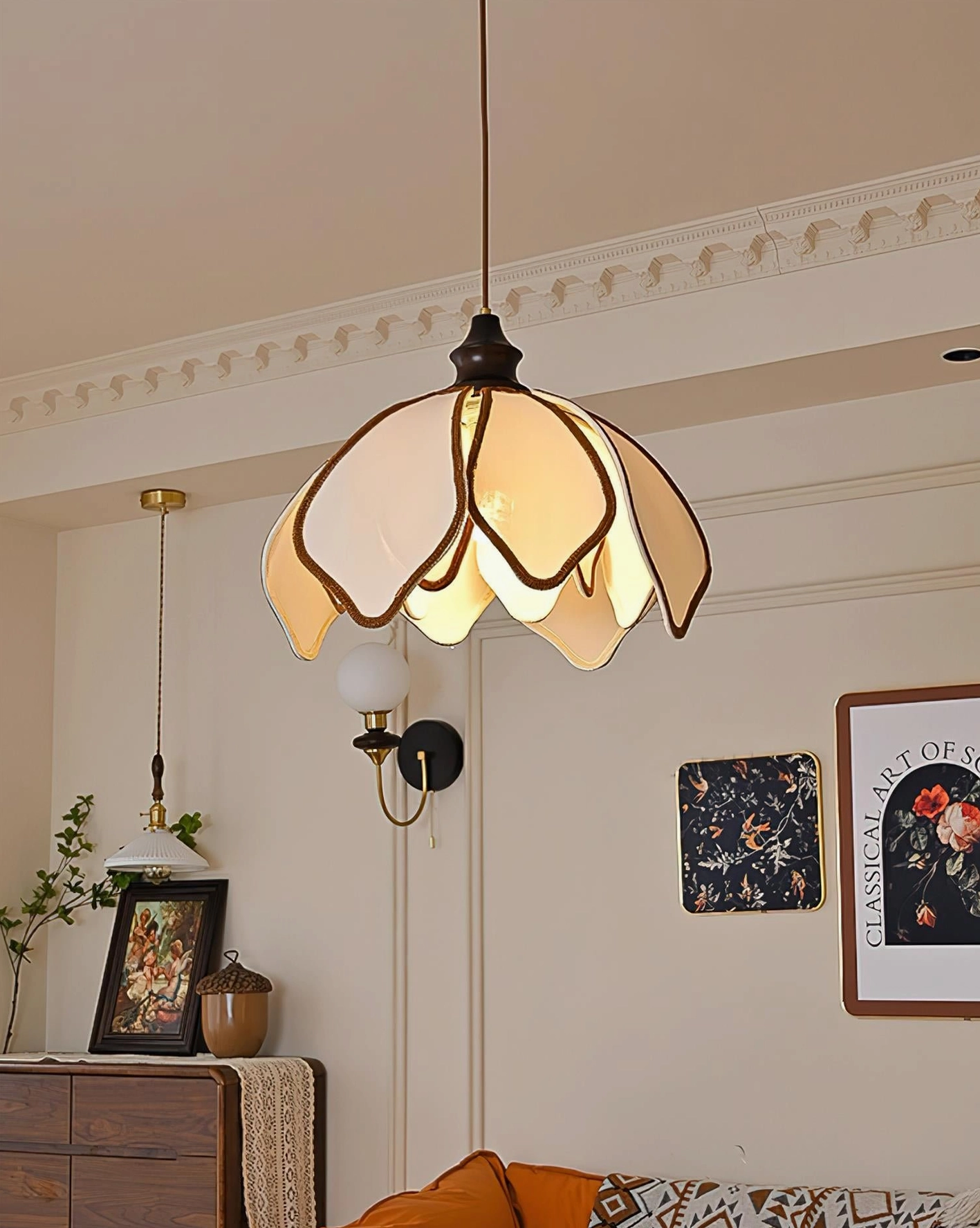 Pauline petal pendant light side view in hallway with wall art and side cabinet, cozy warm home interior style