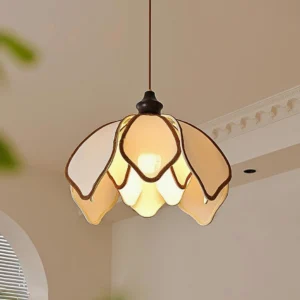 Pauline petal pendant light three-quarter perspective showing illuminated interior and metal fixture, warm ambient glow