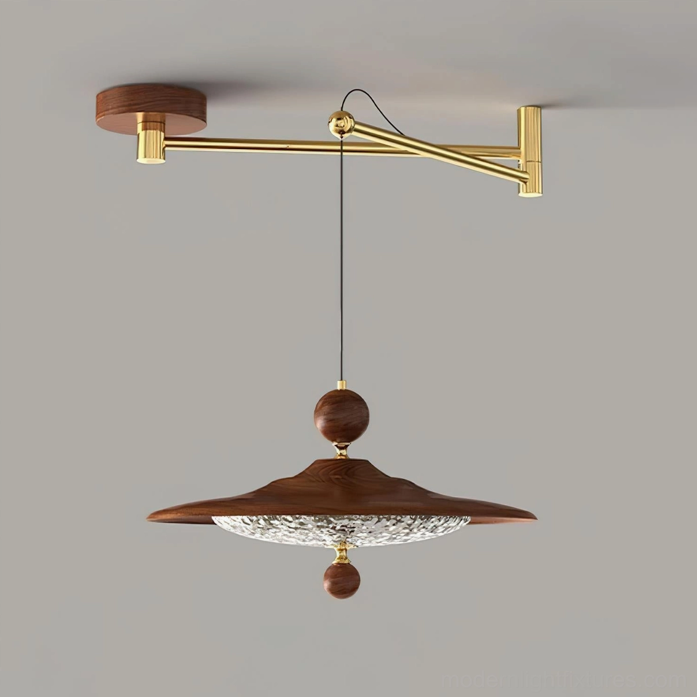 Modern swing arm pendant lamp with simplified metal hardware design, studio photography against neutral background, architectural lighting fixture