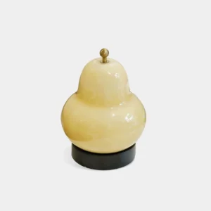 Pear-shaped glass table lamp white studio shot front view minimalist retro design with gold metal finial