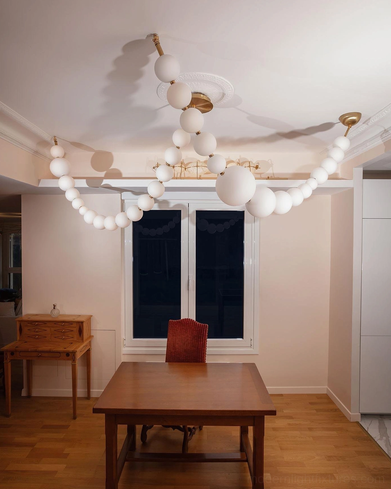 Pearl chandelier with integrated LED creating ambient warm white or cool white illumination