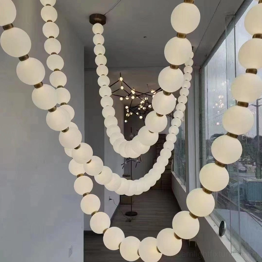 Modern pearl chandelier detail showing LED integrated design and sealed fixture construction