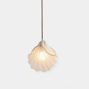 Pearl shell pendant light with scalloped frosted glass shade and gold bead trim, studio view