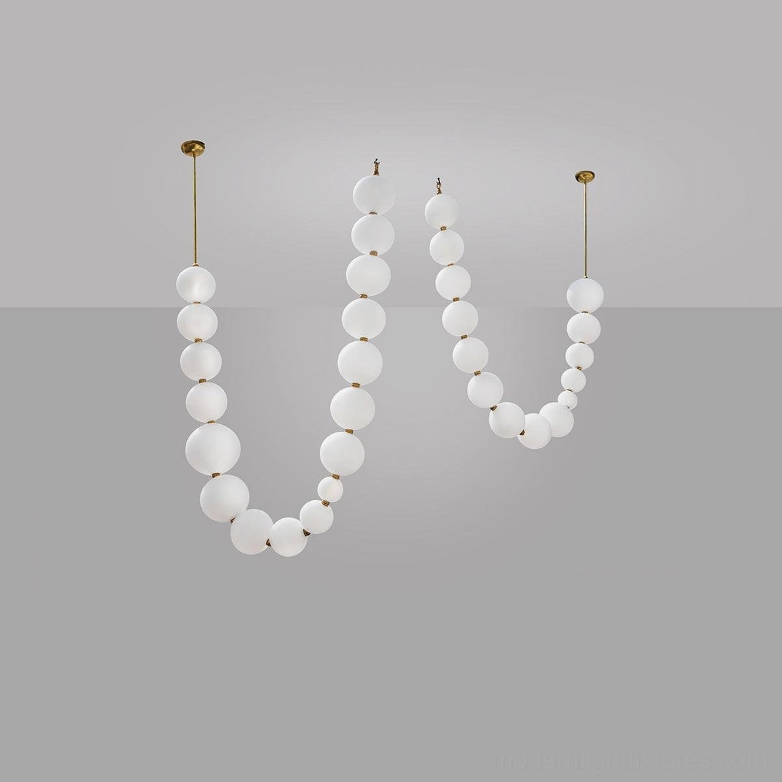 Pearl string chandelier overhead view demonstrating spatial arrangement of frosted acrylic spheres