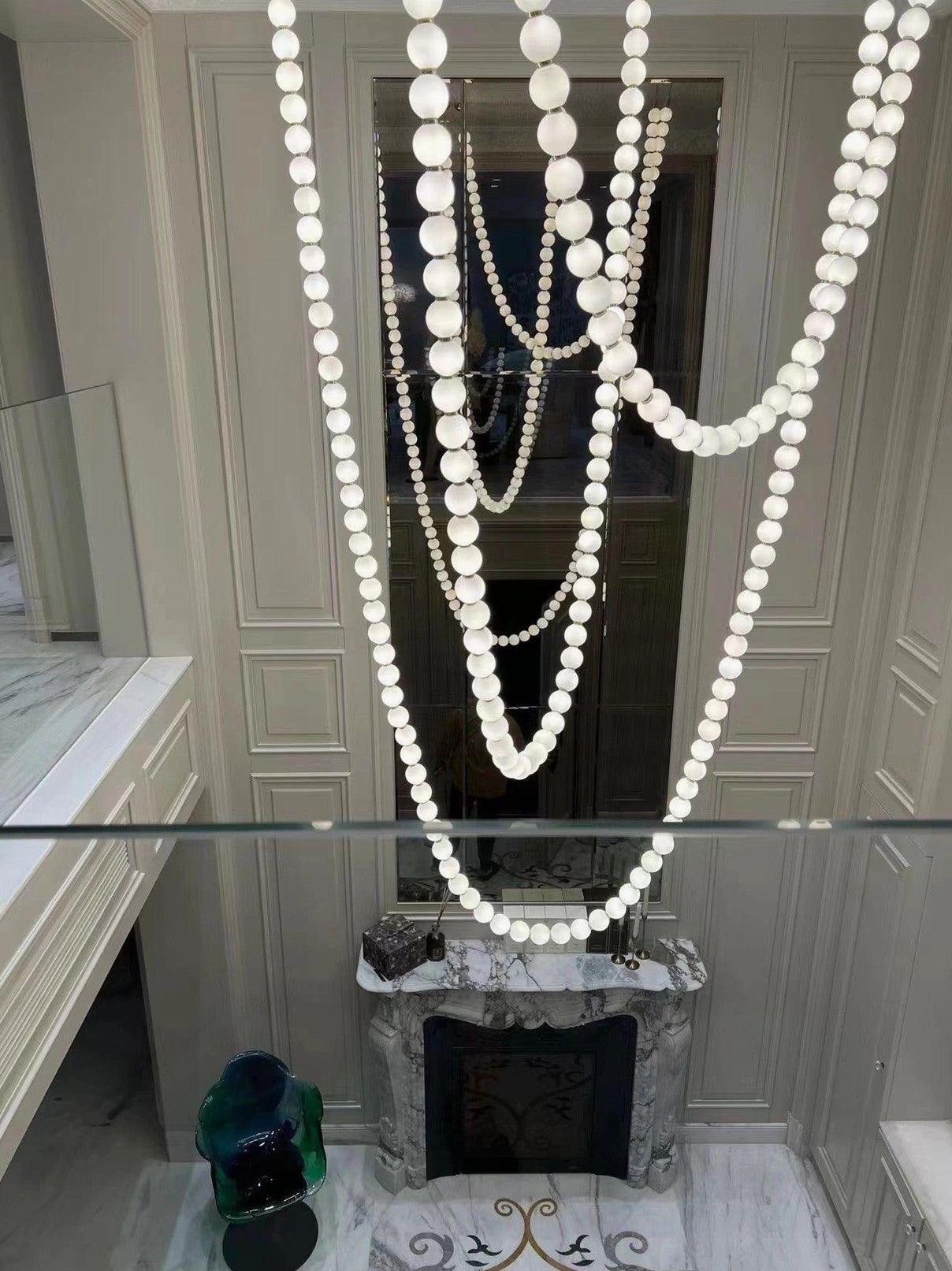 Pearl string chandelier in upscale commercial hospitality venue or luxury residence