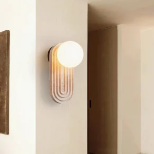 Pearla wall sconce installed hallway interior warm ambient lighting beige textured wall