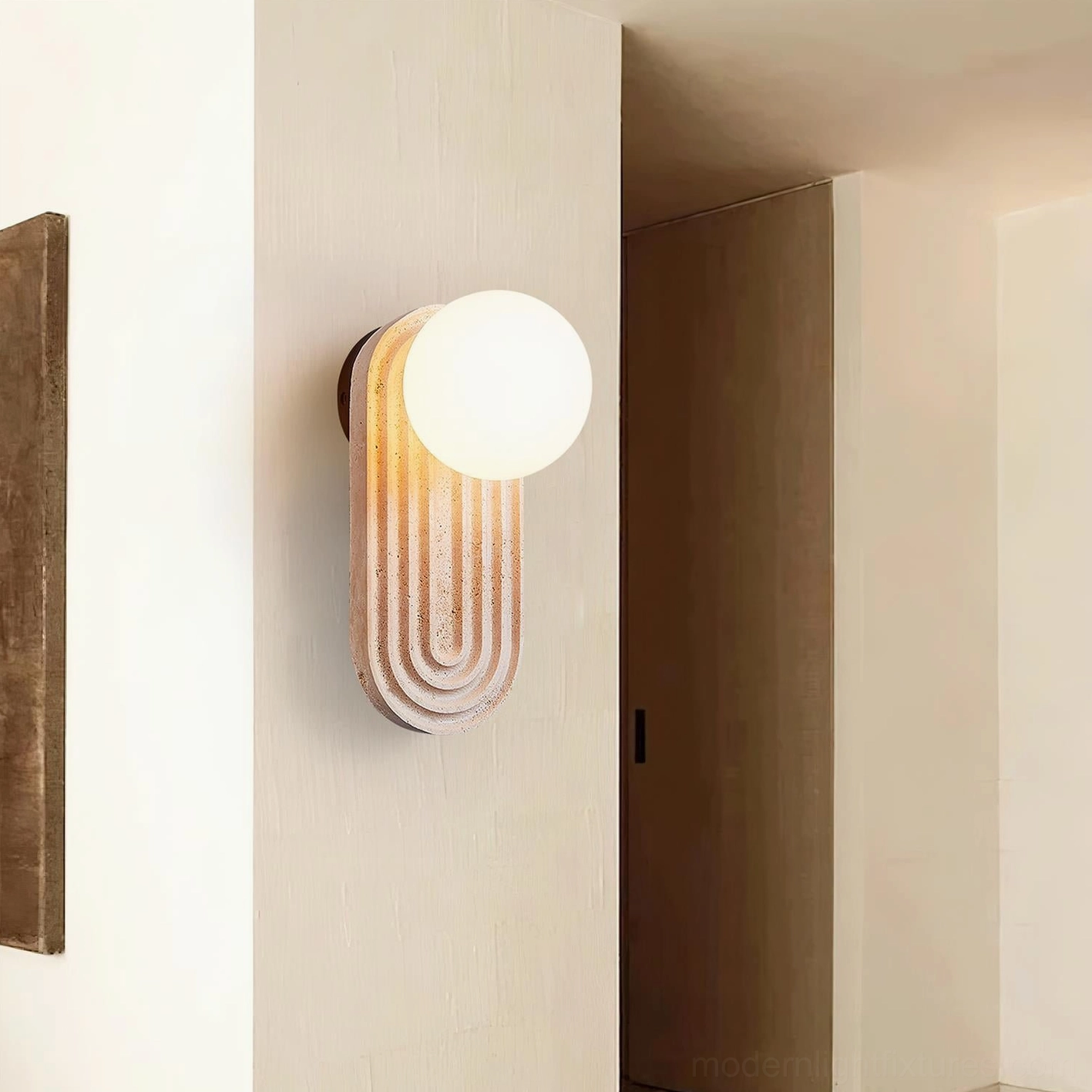 Pearla wall sconce installed hallway interior warm ambient lighting beige textured wall