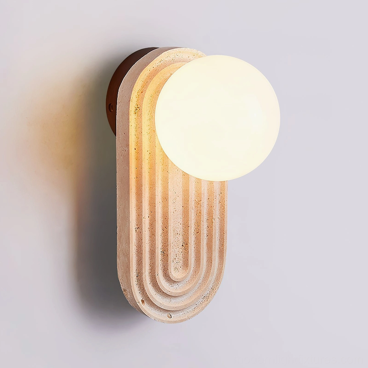 Pearla travertine sconce warm glow ambient lighting modern home design aesthetic