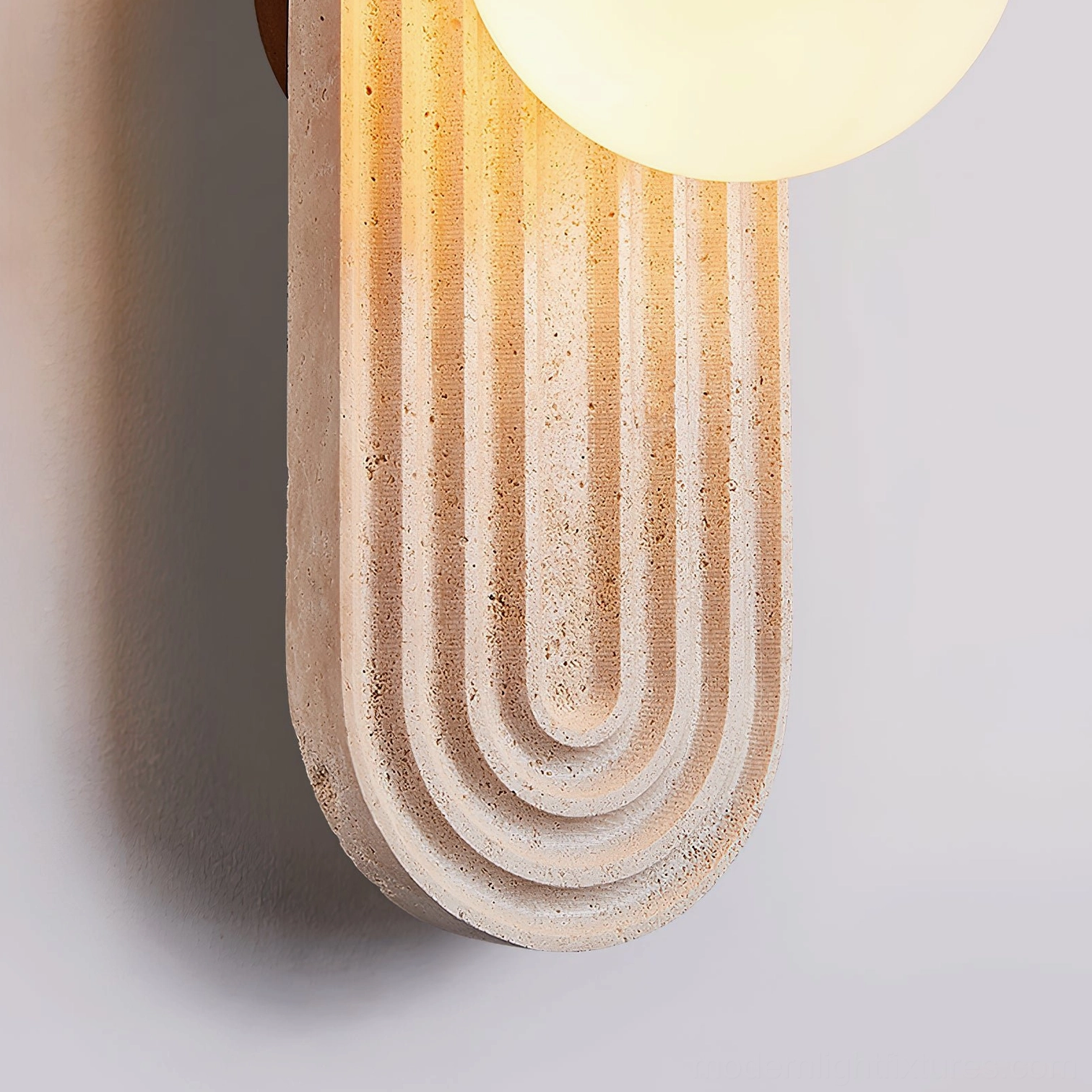 Pearla travertine wall lamp detail texture pitting natural stone characteristics