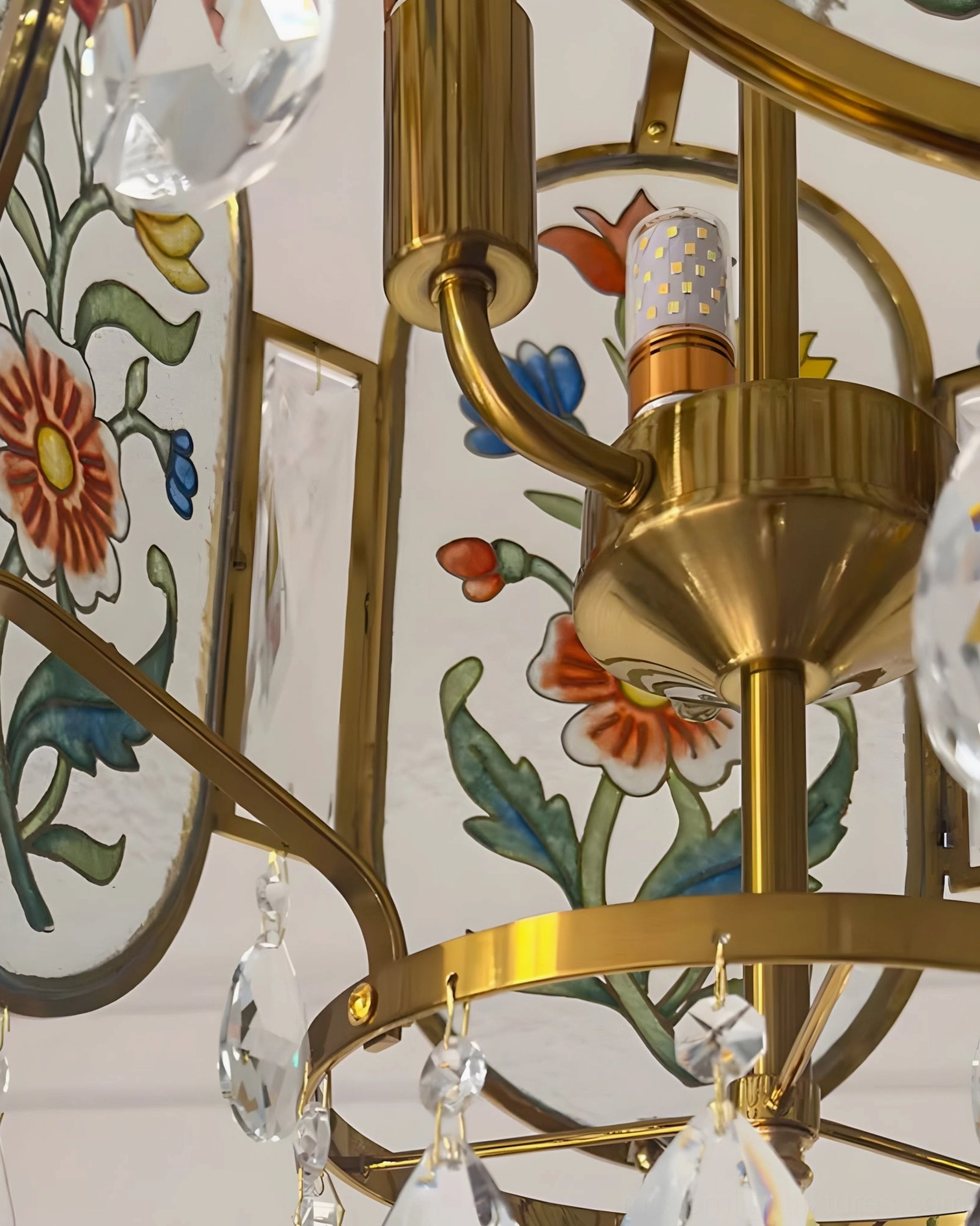 Jardinelle pendant light showing arched lantern silhouette with elegant brass frame in sophisticated gallery setting